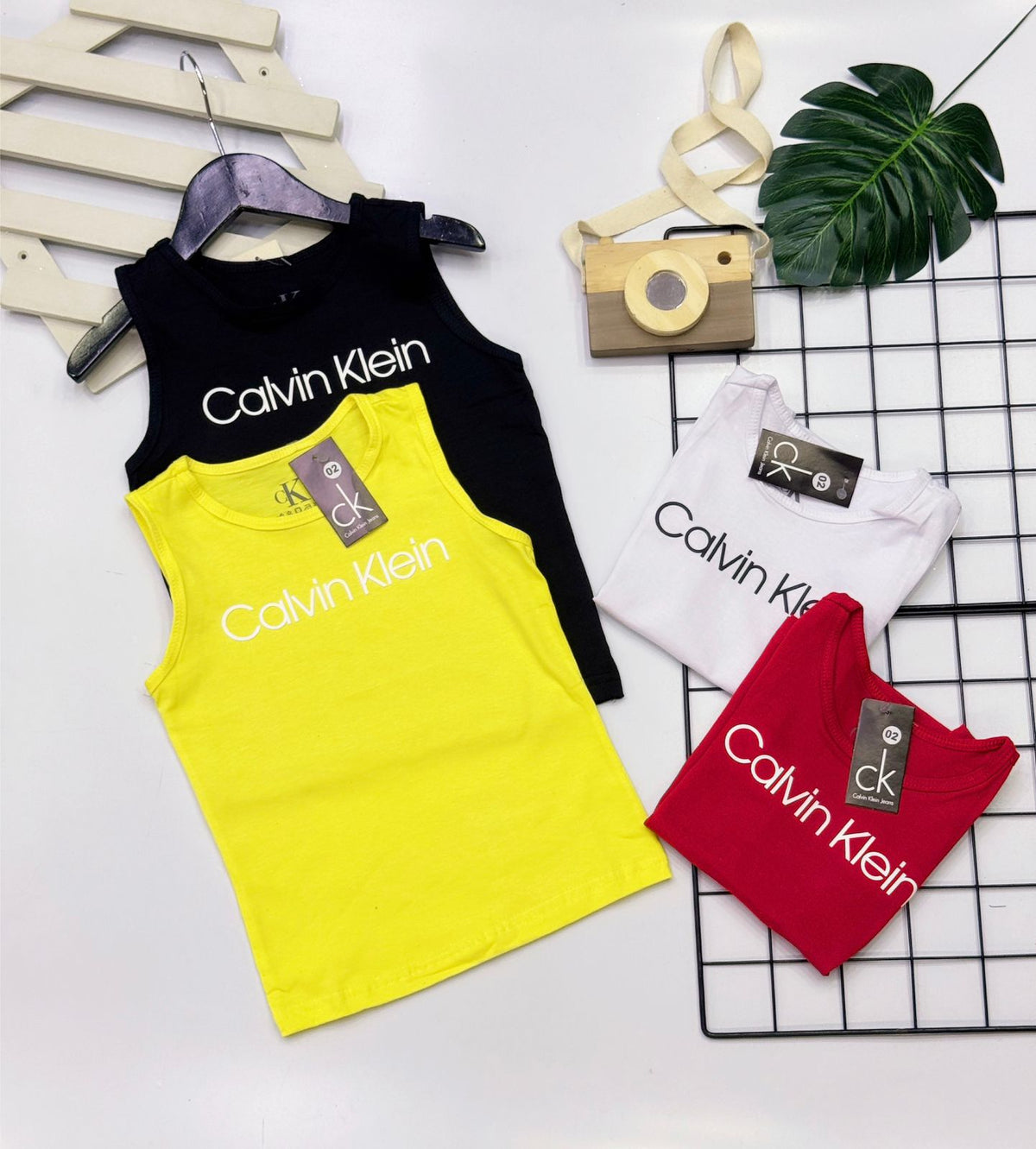 Camiseta Regata CK Tamanho 4 e 10  - Última Peça